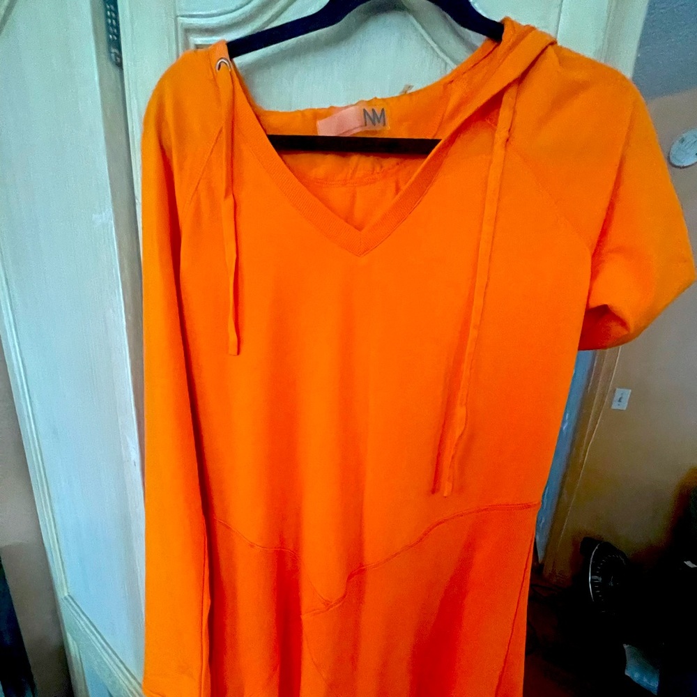 Orange NM sport dress. New condition without tags.